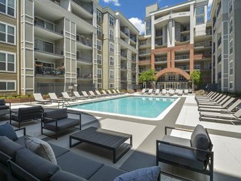 a swimming pool in front of an apartment building at The Citizen at Shirlington Village, Arlington 